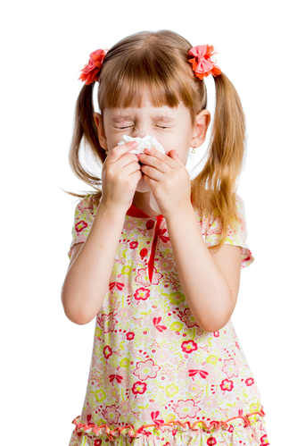 child girl wiping or cleaning nose with tissue isolated on white